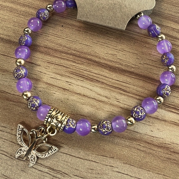 Purple glass and acrylic beads purple stretchy bracelet with gold accents - Picture 3 of 3